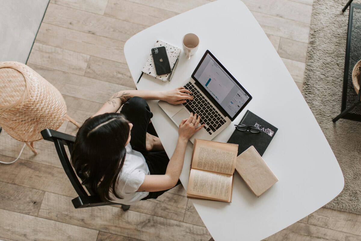 A birdseye view of a woman working at her desk 